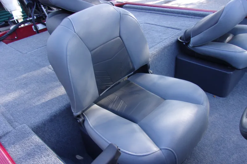 Slide: The Image of 2024 Bass Tracker Classic XL boat seat with gray upholstery and detailed stitching. - 6