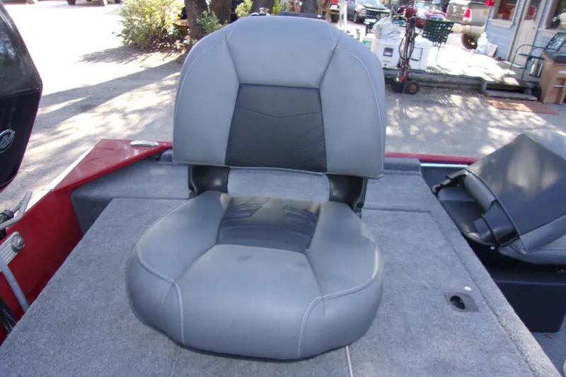 Slide: The Image of 2024 Bass Tracker Classic XL boat seat, gray upholstery, outdoor setting. - 7