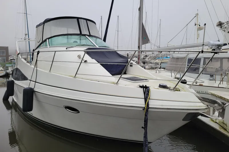 The Image of 2006 Carver 36 Mariner yacht docked at marina, featuring sleek design and spacious deck. - 0