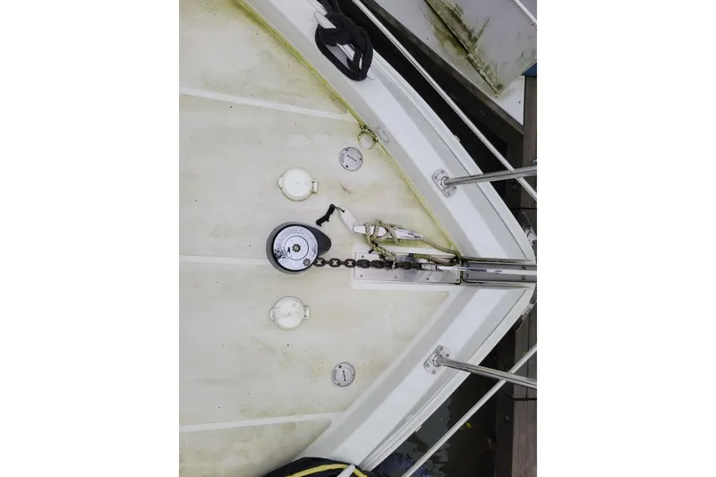 Slide: The Image of 2006 Carver 36 Mariner yacht docked at marina, featuring sleek design and American flag. - 10