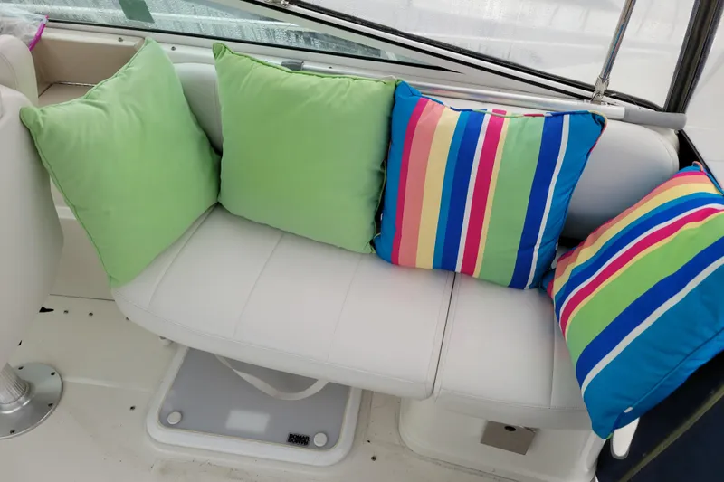 Slide: The Image of 2006 Carver 36 Mariner boat deck with white flooring and railing. - 14