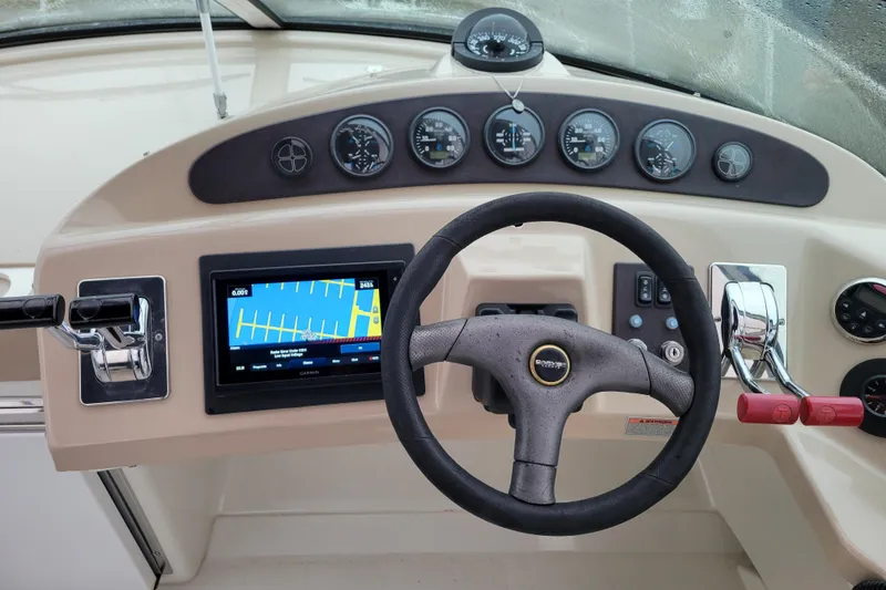 Slide: The Image of 2006 Carver 36 Mariner docked, showing deck and cockpit area. - 17