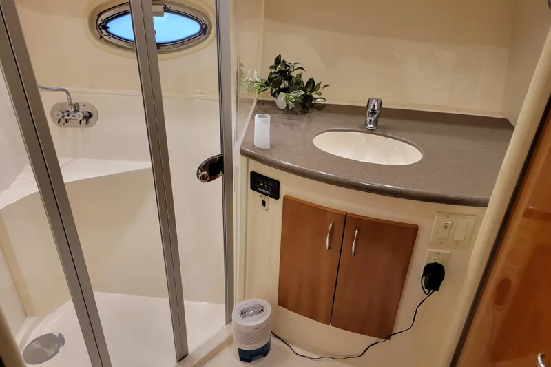 Slide: The Image of Control panel of a 2006 Carver 36 Mariner boat with switches and radio. - 28