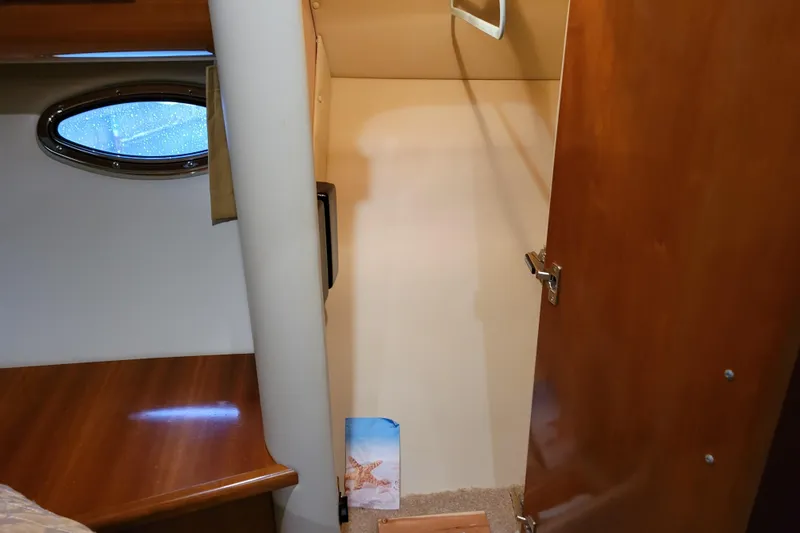 Slide: The Image of Luxurious interior of 2006 Carver 36 Mariner yacht with beige seating and cushions. - 36