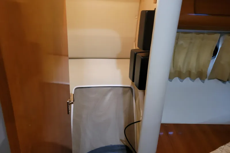 Slide: The Image of Ceramic cooktop on 2006 Carver 36 Mariner yacht, featuring two burners and control knobs. - 38