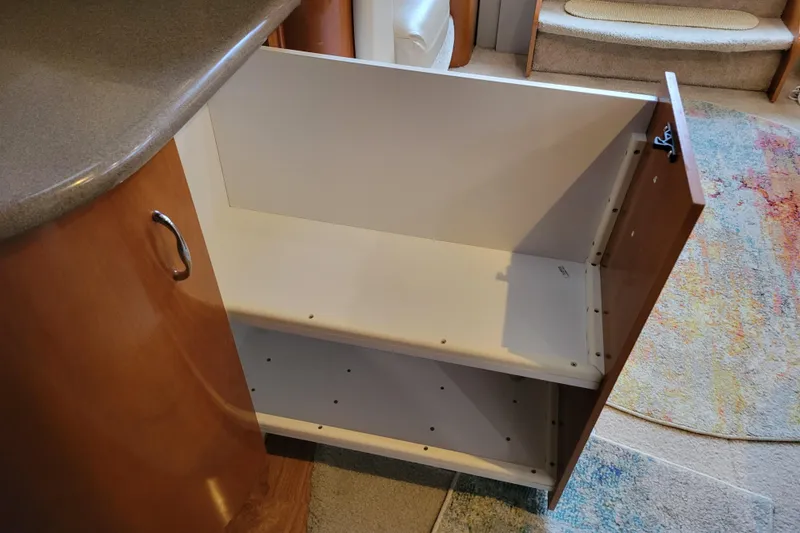 Slide: The Image of 2006 Carver 36 Mariner interior with audio system and fan control panel. - 40