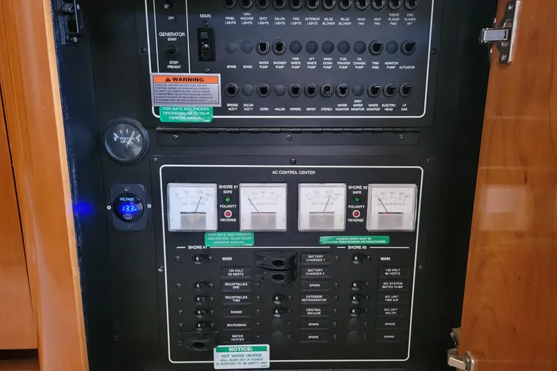 Slide: The Image of Open cabinet in 2006 Carver 36 Mariner yacht interior, showcasing storage space. - 55