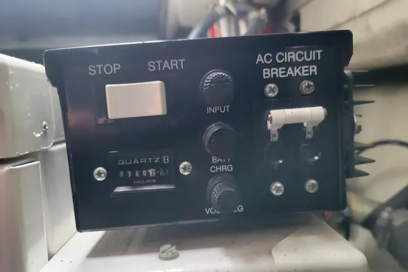 Slide: The Image of Control panel of a 2006 Carver 36 Mariner with stop/start switch and AC circuit breaker. - 68