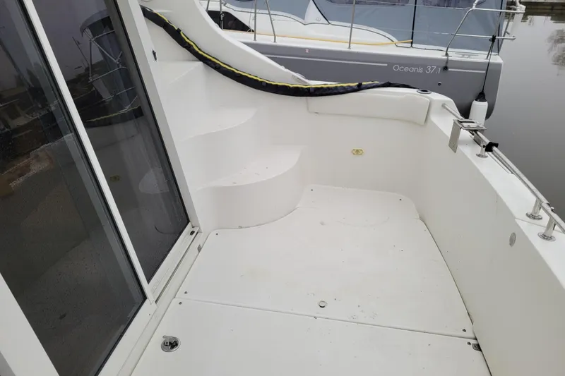 Slide: The Image of 2006 Carver 36 Mariner yacht docked at marina, featuring sleek design and modern amenities. - 7