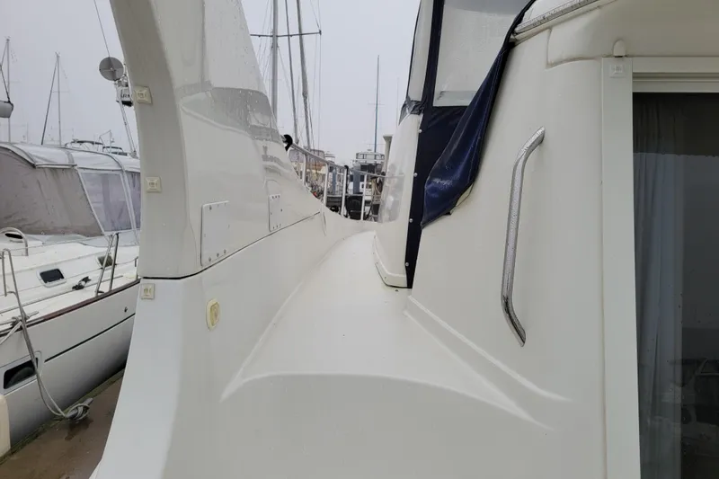 Slide: The Image of 2006 Carver 36 Mariner yacht docked at marina, featuring sleek design and modern amenities. - 8