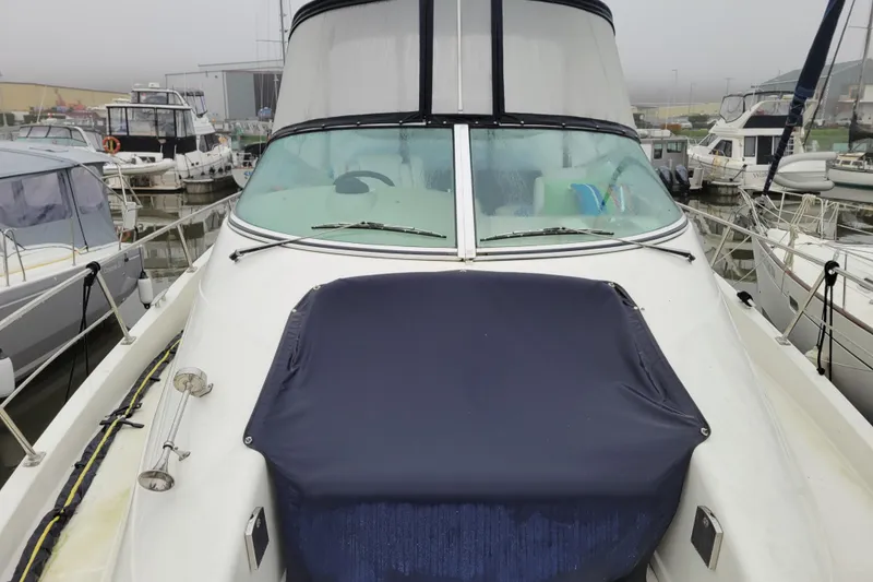 Slide: The Image of 2006 Carver 36 Mariner docked at marina, Everett, WA, with American flag. - 11