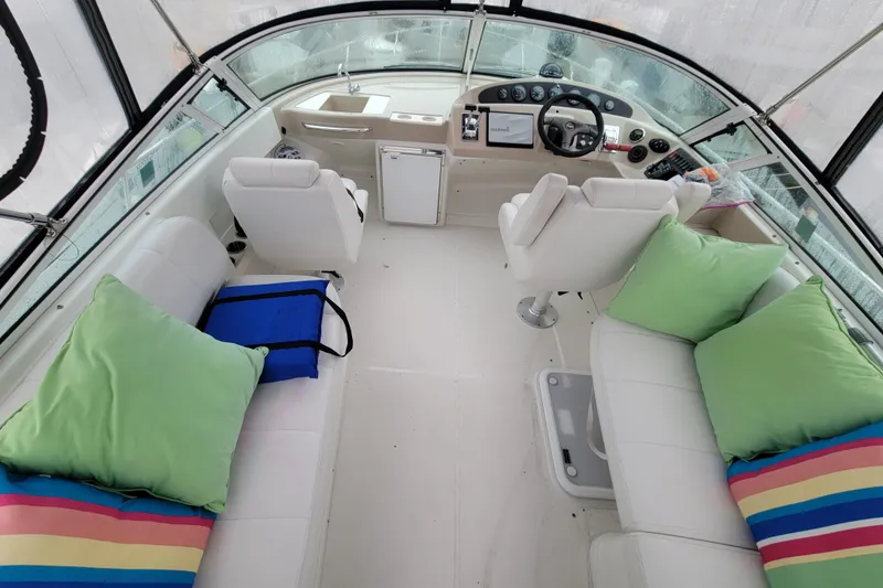 Slide: The Image of 2006 Carver 36 Mariner boat deck with American flag, docked at marina. - 12