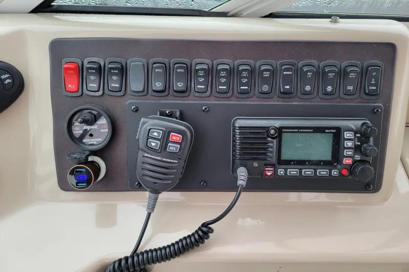 Slide: The Image of Cushioned seating on 2006 Carver 36 Mariner boat with colorful pillows. - 19