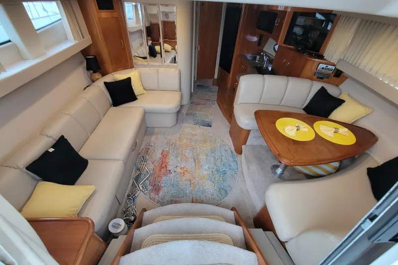 Slide: The Image of 2006 Carver 36 Mariner cockpit with sink, control panel, and storage compartment. - 22