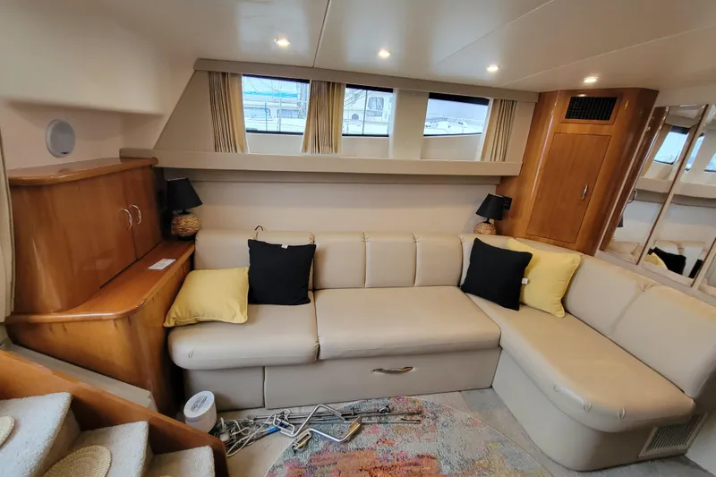 Slide: The Image of Captain's seat on 2006 Carver 36 Mariner with colorful cushions and control panel. - 23