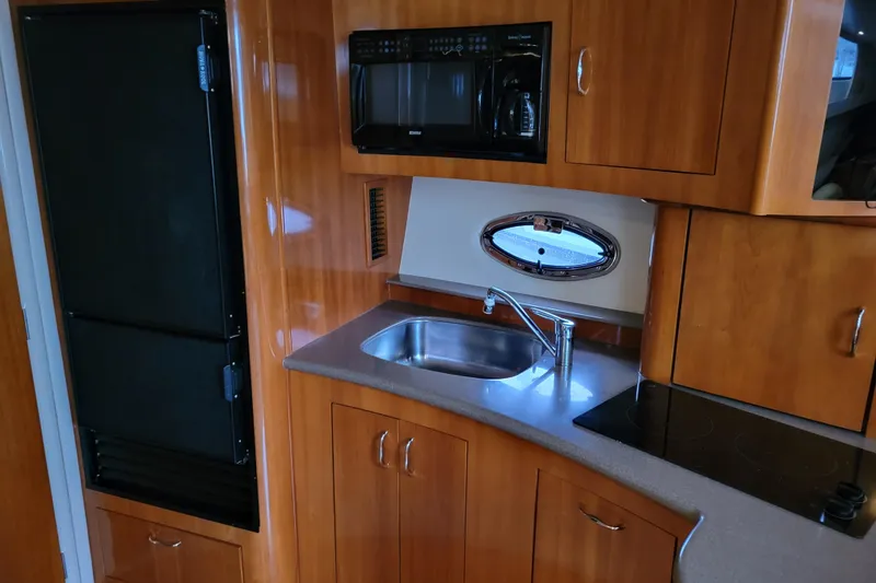 Slide: The Image of Dashboard of 2006 Carver 36 Mariner with gauges and compass. - 25