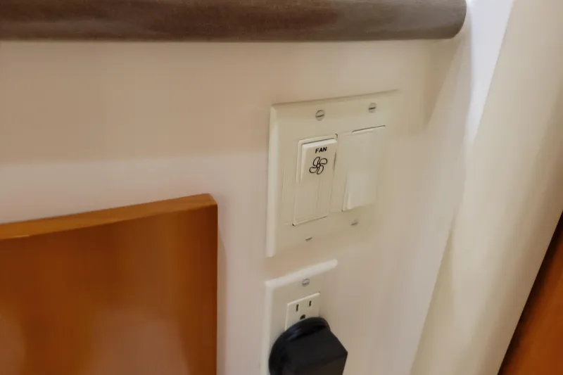 Slide: The Image of Luxurious interior of a 2006 Carver 36 Mariner yacht with plush seating and elegant decor. - 32