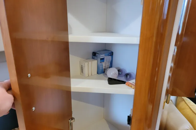 Slide: The Image of Fan switch and outlet on 2006 Carver 36 Mariner yacht interior wall. - 46