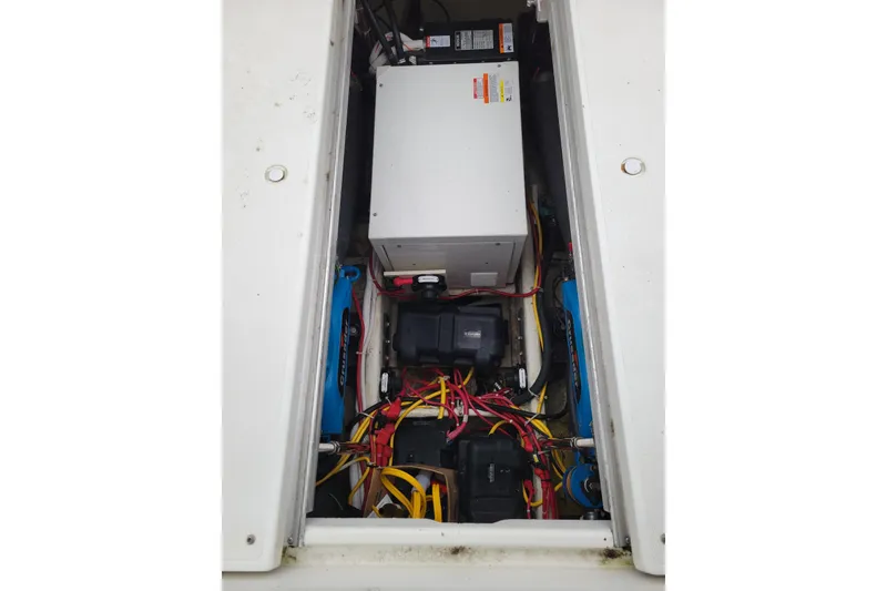 Slide: The Image of Interior of 2006 Carver 36 Mariner with wooden cabinets and porthole window. - 48