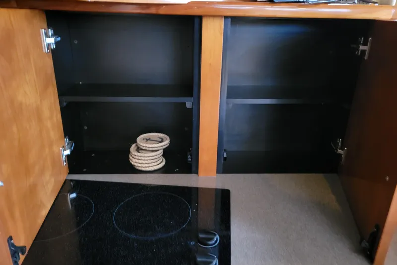 Slide: The Image of 2006 Carver 36 Mariner interior cabin with wooden door and window curtains. - 52