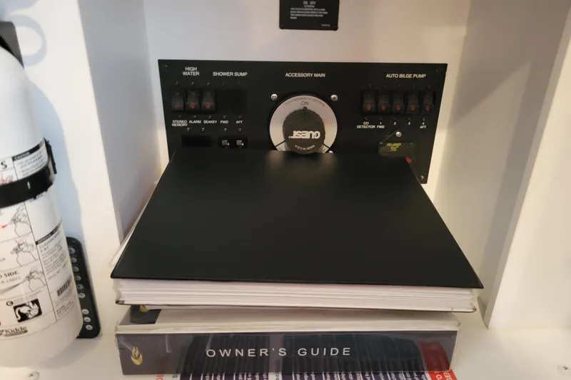 Slide: The Image of Open cabinet in 2006 Carver 36 Mariner yacht interior, showcasing storage space. - 54