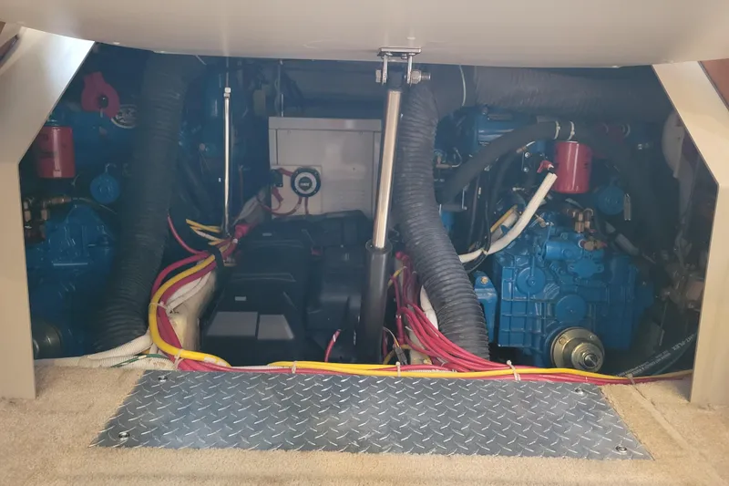 Slide: The Image of 2006 Carver 36 Mariner interior electronics setup with wiring and devices. - 58