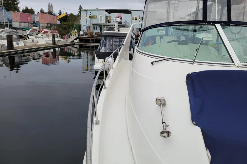 Slide: The Image of 2006 Carver 36 Mariner yacht docked at marina, surrounded by other boats. - 73