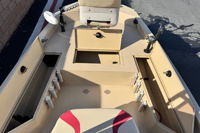 Slide: The Image of 2021 G3 Bay 20 DLX boat interior with storage compartments and rod holders. - 13