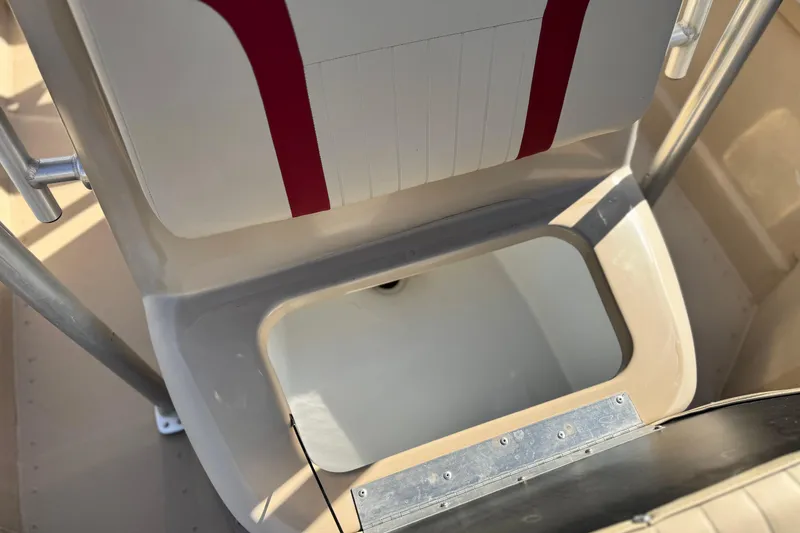 Slide: The Image of 2021 G3 Bay 20 DLX boat seat with storage compartment, beige and red design. - 15