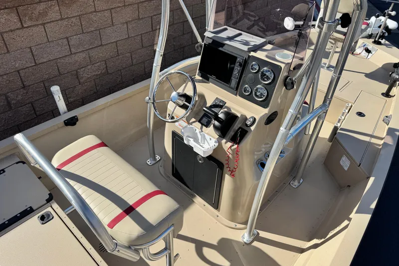 Slide: The Image of 2021 G3 Bay 20 DLX boat interior with steering console and seating. - 22