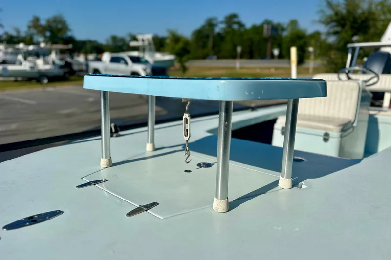 Slide: The Image of 1986 Dolphin 16 SUPER SKIFF boat detail with blue platform and metal supports. - 13