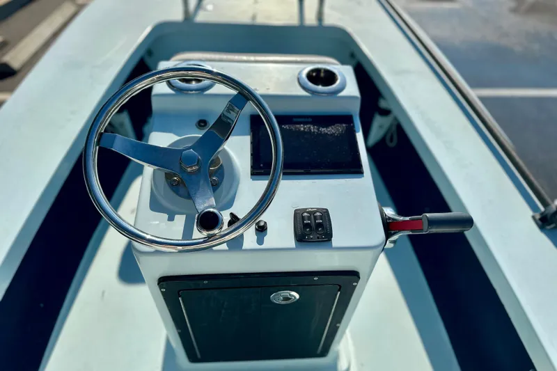 Slide: The Image of Steering console of 1986 Dolphin 16 SUPER SKIFF boat with controls and wheel. - 14