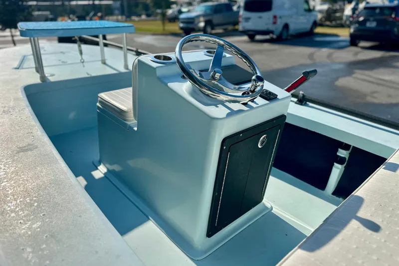 Slide: The Image of 1986 Dolphin 16 SUPER SKIFF boat interior with steering wheel and control panel. - 8