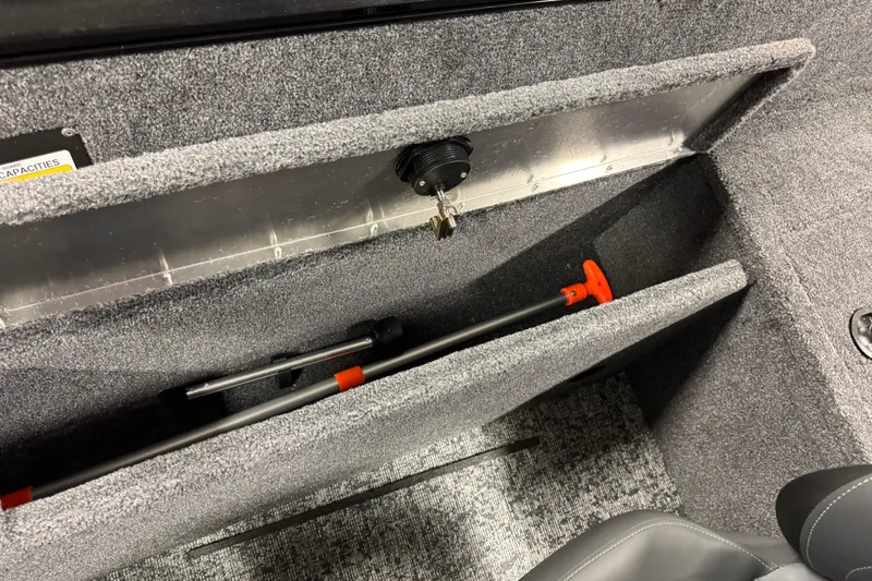 Slide: The Image of Interior storage of 2026 Tracker Pro Guide V-175 WT boat with safety equipment. - 12