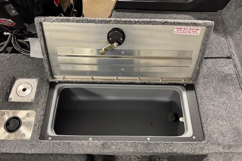 Slide: The Image of Open storage compartment in 2026 Tracker Pro Guide V-175 WT boat, featuring pump-out feature. - 15