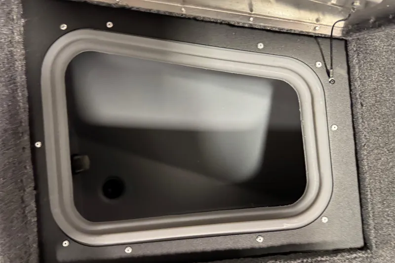 Slide: The Image of 2026 Tracker Pro Guide V-175 WT storage compartment with secure lid and durable design. - 21