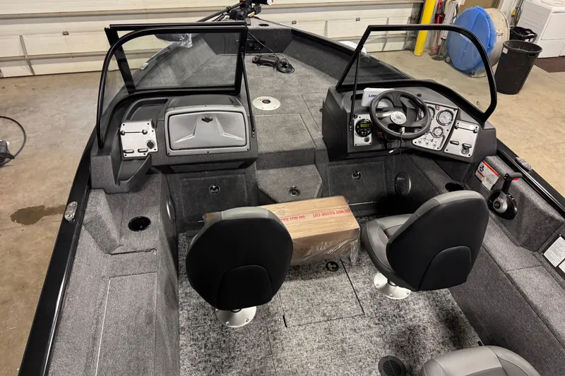 Slide: The Image of 2026 Tracker Pro Guide V-175 WT boat interior with dual seats and control panel. - 25