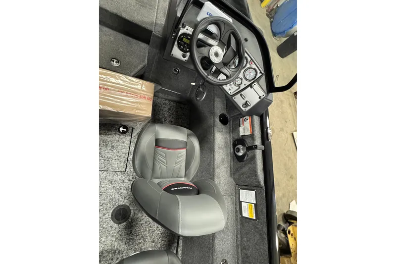 Slide: The Image of 2026 Tracker Pro Guide V-175 WT boat interior with steering wheel and seating. - 5
