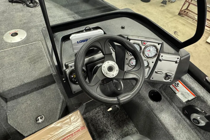 Slide: The Image of Steering console of 2026 Tracker Pro Guide V-175 WT boat with gauges and controls. - 6