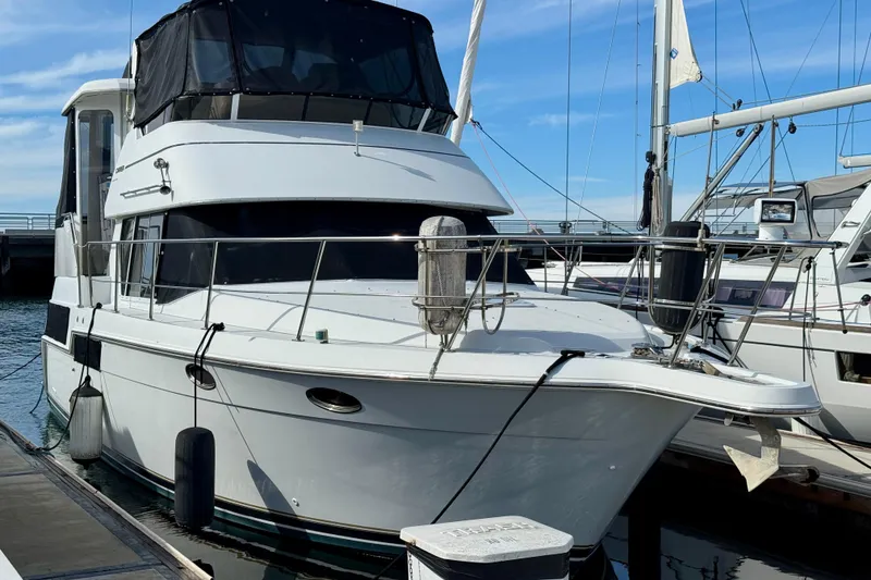 The Image of 1997 Carver 355 Aft Cabin Motor Yacht docked at marina. - 1