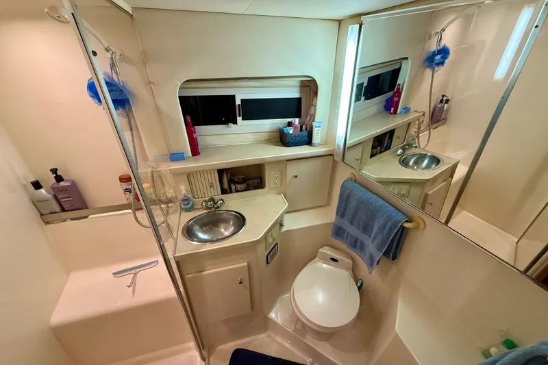 Slide: The Image of Bathroom of 1997 Carver 355 Aft Cabin Motor Yacht with sink, toilet, and shower. - 29