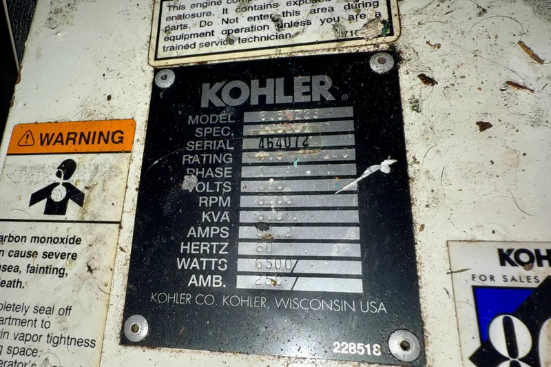 Slide: The Image of Kohler generator label on 1997 Carver 355 Aft Cabin Motor Yacht, showing specifications and warning signs. - 34