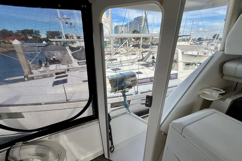 Slide: The Image of Interior view of 1997 Carver 355 Aft Cabin Motor Yacht in marina setting. - 35