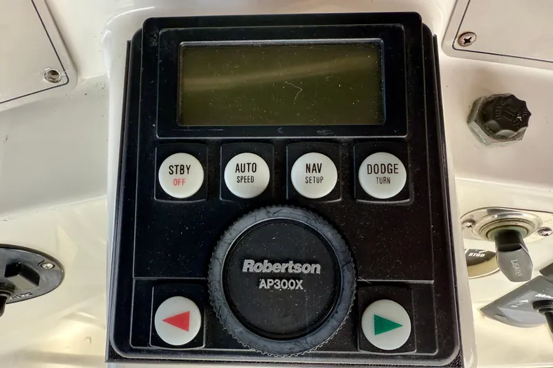 Slide: The Image of Control panel of a 1997 Carver 355 Aft Cabin Motor Yacht, featuring Robertson AP300X. - 17