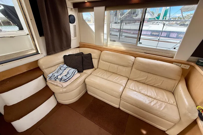 Slide: The Image of Interior of 1997 Carver 355 Aft Cabin Motor Yacht with beige leather seating. - 21