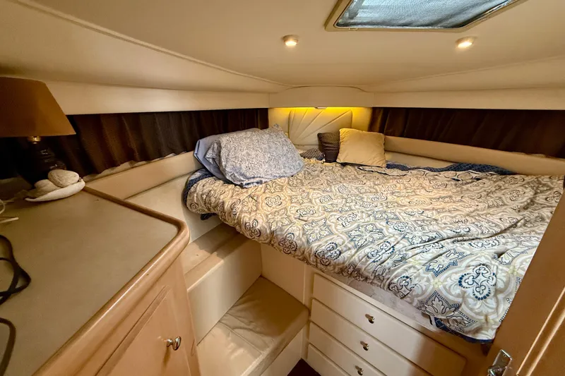Slide: The Image of Cozy bedroom in 1997 Carver 355 Aft Cabin Motor Yacht with patterned bedding. - 26