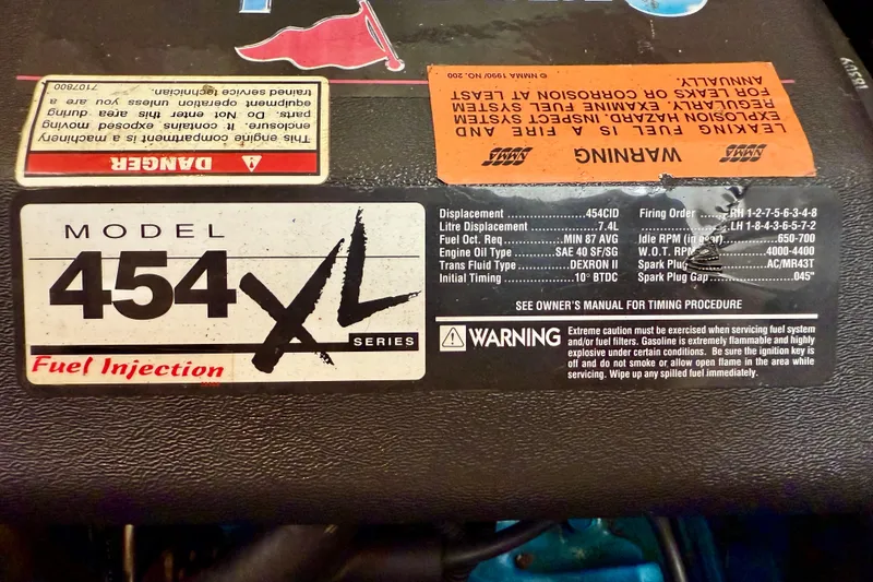 Slide: The Image of 1997 Carver 355 Aft Cabin Motor Yacht engine label, Model 454 XL, fuel injection details. - 32
