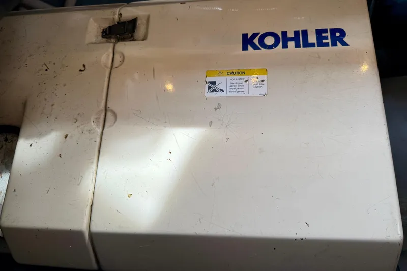Slide: The Image of Kohler generator on 1997 Carver 355 Aft Cabin Motor Yacht, caution label visible. - 33
