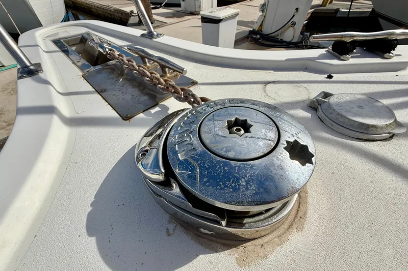 Slide: The Image of 1997 Carver 355 Aft Cabin Motor Yacht anchor windlass and chain on deck. - 9