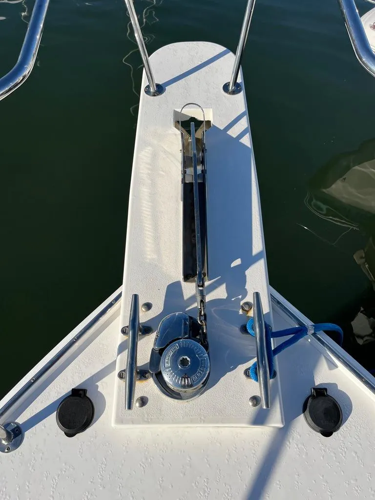 Slide: The Image of Bow of 2001 Northern Bay 36 boat with anchor winch and railing. - 12